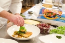 Plating LA Gulf fish with Jazzmen Brown Rice by Executive Chef Travis Johnson - Tulane Sodexo